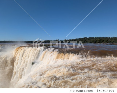 A close-up of the Iguazu River's waters cascading into a waterfall in Iguazu National Park and Reserve in Argentina, June A close-up of the Iguazu River's waters cascading into a waterfall in Iguazu National Park and Reserve in Argentina, June 139308595
