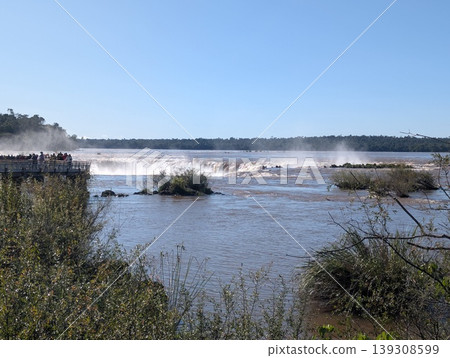 Iguazu, Argentina - June 24, 2025: The first river falls and tourists at the observation deck in Argentina's Iguazu National Park 139308599