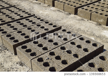 Cinder blocks lie on the ground and dried. on cinder block produ Cinder blocks lie on the ground and dried. on cinder block produ 139308653