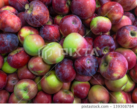 Fresh red and green apples pile at farmers market, autumn harvest Fresh red and green apples pile at farmers market, autumn harvest 139308784