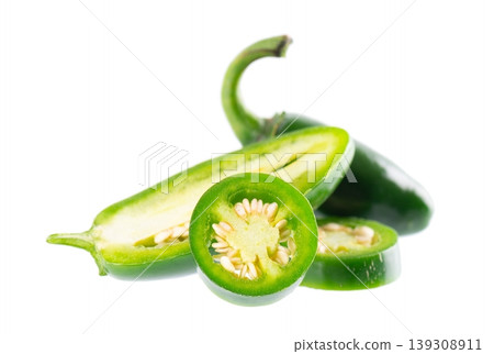 Fresh jalapeno pepper isolated on white background. Slices of green hot serrano pepper. Clipping path. Fresh jalapeno pepper isolated on white background. Slices of green hot serrano pepper. Clipping path. 139308911