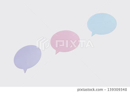 Pastel speech bubble cutouts arranged on white surface with copy space for message, dialogue, chat, feedback, social media design. Concept of bubble communication, conversation, text placement 139309348
