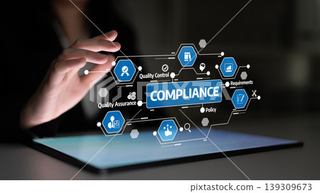 Hand Reaching Towards Digital Interface Showing Compliance, Quality Control, Policy, and Assurance Icons in a Modern Business Environment. Tessel Hand Reaching Towards Digital Interface Showing Compliance, Quality Control, Policy, and Assurance Icons in a Modern Business Environment. Tessel 139309673