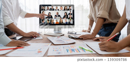 Business people on video conference for brisk virtual group meeting 139309786