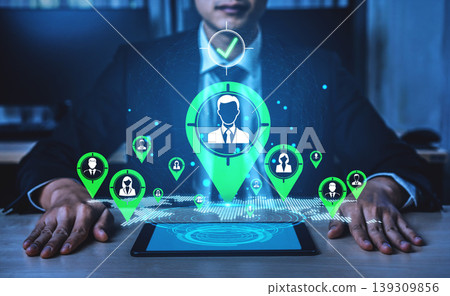 Businessman at Desk Using Technology for Data Analytics and User Engagement with Digital Icons and Location Markers Representing Connections Fluxor Businessman at Desk Using Technology for Data Analytics and User Engagement with Digital Icons and Location Markers Representing Connections Fluxor 139309856
