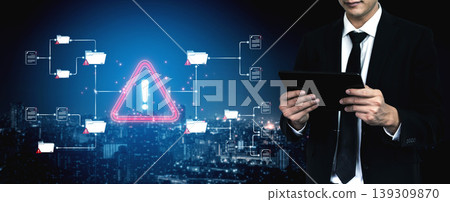 A businessman examines security alerts on a tablet, highlighting the importance of data protection and awareness in a dynamic urban environment, emphasizing urgency and responsibility. Sigmoid A businessman examines security alerts on a tablet, highlighting the importance of data protection and awareness in a dynamic urban environment, emphasizing urgency and responsibility. Sigmoid 139309870