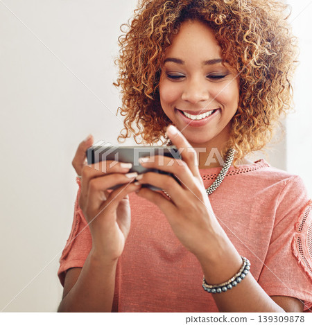 Phone games, relax or happy woman on break playing online gaming, subscription or connection. Designer, video gamer or African person with mobile app in workplace for streaming multimedia with smile Phone games, relax or happy woman on break playing online gaming, subscription or connection. Designer, video gamer or African person with mobile app in workplace for streaming multimedia with smile 139309878
