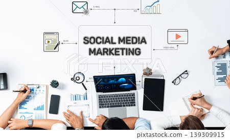 Collaborative Workspace for Social Media Marketing Strategy Development with Laptops, Notebooks, and Digital Tools for Successful Campaigns. Raster 139309915