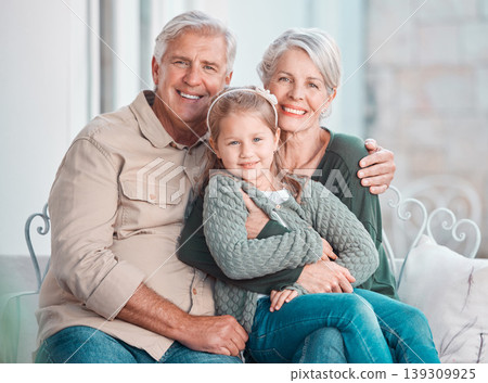 Grandparents, hug and portrait on couch with girl, care and bonding with love, retirement and home living room. Happy old man, elderly woman and embrace child in lounge, relax and pride in apartment Grandparents, hug and portrait on couch with girl, care and bonding with love, retirement and home living room. Happy old man, elderly woman and embrace child in lounge, relax and pride in apartment 139309925