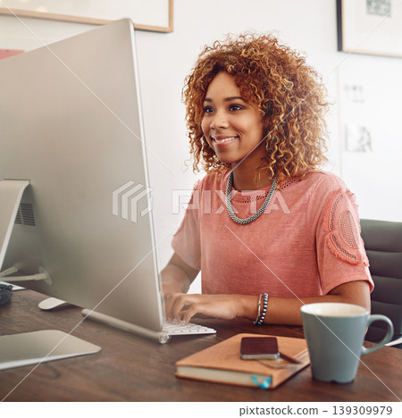 Workplace, happy or designer with computer for research, editing or copywriting on blog or website. Startup, smile or African woman in office working on internet update, networking or reading news 139309979