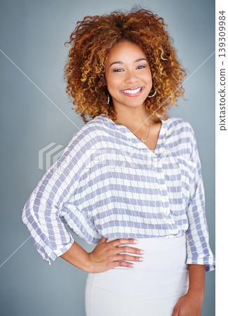 Portrait, confident and happy business woman isolated on a gray background in company office. Creative, professional and young designer, female entrepreneur and employee working at startup in Brazil Portrait, confident and happy business woman isolated on a gray background in company office. Creative, professional and young designer, female entrepreneur and employee working at startup in Brazil 139309984