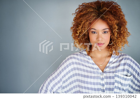 Portrait, confident and creative business woman isolated on a gray background mockup space. Serious face, professional designer and entrepreneur, young worker or employee at startup in South Africa Portrait, confident and creative business woman isolated on a gray background mockup space. Serious face, professional designer and entrepreneur, young worker or employee at startup in South Africa 139310042