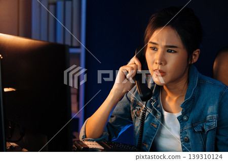 Young beautiful Asian creative woman calling on phone desk. Stratagem. 139310124