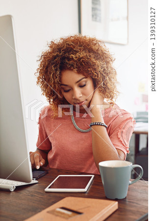 Office, social media or designer with tablet for research, editing or copywriting on blog in agency. Technology, phone or African woman at desk working on internet update, networking or reading news 139310127