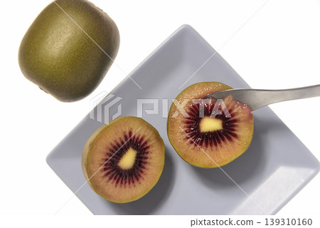 A close-up, overhead view of a ruby red kiwi. A close-up, overhead view of a ruby red kiwi. 139310160