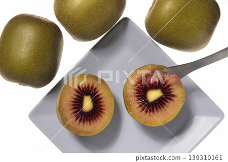 A close-up, overhead view of a ruby red kiwi. A close-up, overhead view of a ruby red kiwi. 139310161
