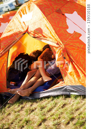 Couple, feet or happy in tent in nature, camping or romantic love for weekend vacation in forest. Man, woman and legs together for marriage bonding in countryside, relax and travel in woods in summer Couple, feet or happy in tent in nature, camping or romantic love for weekend vacation in forest. Man, woman and legs together for marriage bonding in countryside, relax and travel in woods in summer 139310188