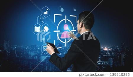 Businessman Using Tablet for Data Analysis with User Interface Graphics and Background Cityscape at Night for Technology Concept Gantry Businessman Using Tablet for Data Analysis with User Interface Graphics and Background Cityscape at Night for Technology Concept Gantry 139310225