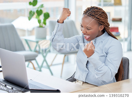 Black woman, laptop and fist celebration in office for goal, investment profit or revenue on stock market. African trader, person and winner with cheers, computer and excited for financial freedom 139310270
