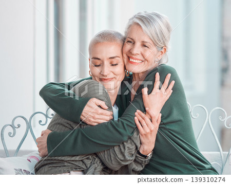 Happy, hugging and senior mother with woman in the living room for bonding, love and care at home. Smile, sweet and elderly female person in retirement embracing adult daughter at house in Australia. Happy, hugging and senior mother with woman in the living room for bonding, love and care at home. Smile, sweet and elderly female person in retirement embracing adult daughter at house in Australia. 139310274