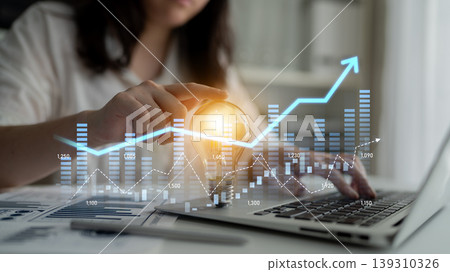 Business professional analyzing financial data trends with laptop, while plotting graphs and charts for investment strategies and market growth opportunities Scalp Business professional analyzing financial data trends with laptop, while plotting graphs and charts for investment strategies and market growth opportunities Scalp 139310326