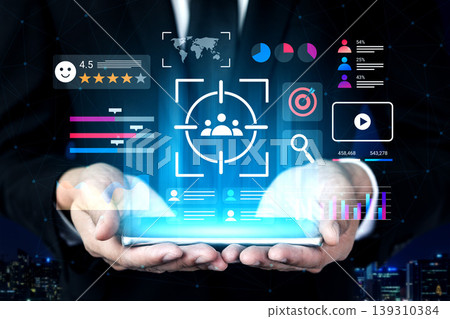 Businessman Holding a Digital Interface Showing Data Analytics and Target Audience Visualizations in Modern City Environment Gantry Businessman Holding a Digital Interface Showing Data Analytics and Target Audience Visualizations in Modern City Environment Gantry 139310384