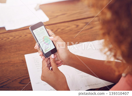 Phone, hands or designer with chart for research, technology or graphs analysis on website. Reading data analytics, planning or female person working stats update on mobile app screen with paperwork 139310407