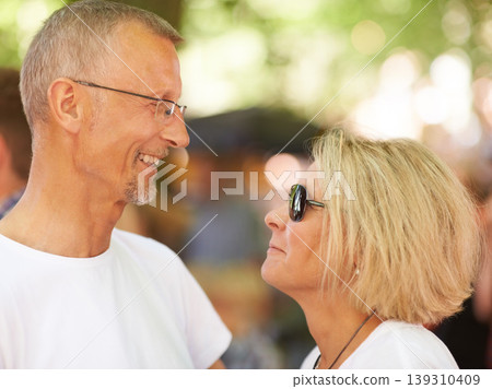 Outdoor, event and senior couple with love, marriage and happiness with romance, festival and summer. Nature, man or woman with joy, bonding together and cheerful with relationship, break or sunshine Outdoor, event and senior couple with love, marriage and happiness with romance, festival and summer. Nature, man or woman with joy, bonding together and cheerful with relationship, break or sunshine 139310409