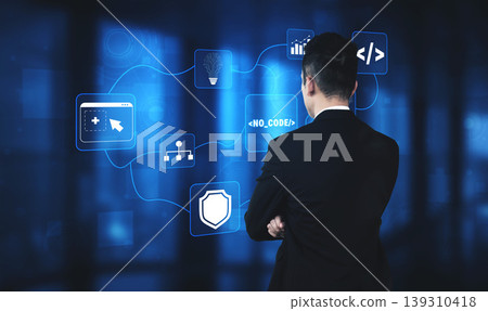Businessman Analyzing Digital Interface with No Code Solution Icons in Modern Office Environment Quark 139310418