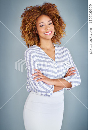 Portrait, happy business woman or arms crossed isolated on a gray background in company office. Confident professional, pride or young creative designer, entrepreneur or employee at startup in Brazil Portrait, happy business woman or arms crossed isolated on a gray background in company office. Confident professional, pride or young creative designer, entrepreneur or employee at startup in Brazil 139310609