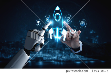 A robot hand and a human hand interact over a glowing rocket launch icon, symbolizing teamwork and innovation in technology and digital advancements for future projects. Sigmoid A robot hand and a human hand interact over a glowing rocket launch icon, symbolizing teamwork and innovation in technology and digital advancements for future projects. Sigmoid 139310623