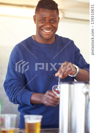 Portrait, party and a black man bartender serving drinks outdoor at an event, festival or celebration. Smile, beer and carnival with a happy young person at a bar in a tent for beverage service 139310631