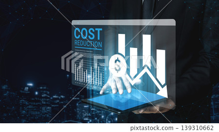 Businessman Analyzing Data on Tablet for Cost Reduction with Graphs and Financial Charts on a Futuristic Background Ledger Businessman Analyzing Data on Tablet for Cost Reduction with Graphs and Financial Charts on a Futuristic Background Ledger 139310662