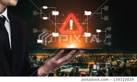 A businessman presents a tablet displaying a warning symbol amidst digital data flow, emphasizing technology, security, and risk management themes in a modern urban environment. Sigmoid A businessman presents a tablet displaying a warning symbol amidst digital data flow, emphasizing technology, security, and risk management themes in a modern urban environment. Sigmoid 139310839