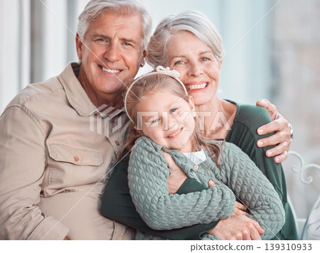 Grandparents, hug and portrait on sofa with child, care and bonding with love, retirement and home living room. Happy old man, elderly woman and embrace girl in lounge, relax and pride in apartment Grandparents, hug and portrait on sofa with child, care and bonding with love, retirement and home living room. Happy old man, elderly woman and embrace girl in lounge, relax and pride in apartment 139310933