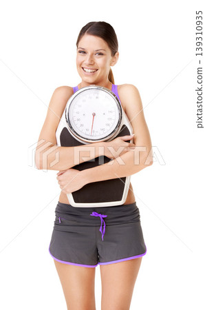 Scale, portrait and woman smile with exercise, success and happy from health care. Workout, fitness and sport training of a healthy female athlete in studio with white background and wellness Scale, portrait and woman smile with exercise, success and happy from health care. Workout, fitness and sport training of a healthy female athlete in studio with white background and wellness 139310935