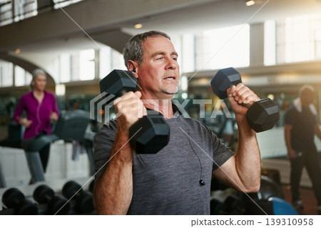 Old man, senior fitness and dumbbells at a gym for weightlifting, challenge or workout, training or bodybuilding. Biceps, arms and elderly person with hand weight for strength, mindset or exercise Old man, senior fitness and dumbbells at a gym for weightlifting, challenge or workout, training or bodybuilding. Biceps, arms and elderly person with hand weight for strength, mindset or exercise 139310958