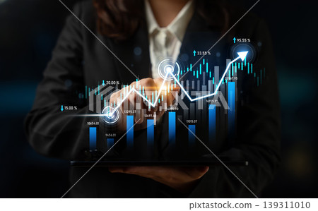 Businesswoman Analyzing Financial Performance with Digital Graphs and Chart Trends on Tablet in Modern Office Environment Scalp Businesswoman Analyzing Financial Performance with Digital Graphs and Chart Trends on Tablet in Modern Office Environment Scalp 139311010