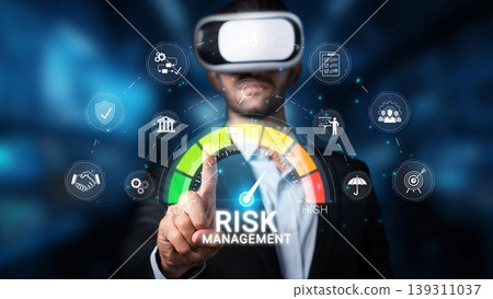 A business professional engages with virtual reality technology to navigate risk management in finance, showcasing interactive digital interfaces for strategic decision-making. Sigmoid A business professional engages with virtual reality technology to navigate risk management in finance, showcasing interactive digital interfaces for strategic decision-making. Sigmoid 139311037