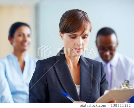 Business woman, writing and clipboard in meeting, presentation or corporate workshop at office. Female person or employee taking notes in staff training, team conference or seminar at workplace Business woman, writing and clipboard in meeting, presentation or corporate workshop at office. Female person or employee taking notes in staff training, team conference or seminar at workplace 139311122