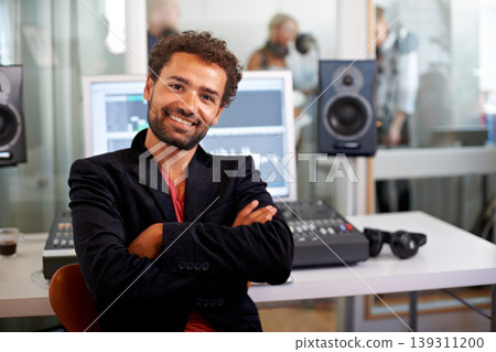 DJ, arms crossed and recording studio portrait with a man and music producer with tech and computer. Sound engineer, audio technician and media with a professional in industry with synthesizer DJ, arms crossed and recording studio portrait with a man and music producer with tech and computer. Sound engineer, audio technician and media with a professional in industry with synthesizer 139311200