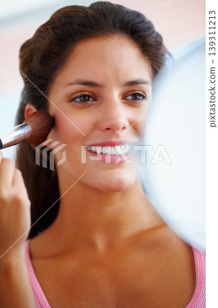 Woman, face and makeup brush with smile for beauty, cosmetics and facial skincare with mirror in home. Person, happy and glow application with product and hand for wellness, cosmetology and aesthetic Woman, face and makeup brush with smile for beauty, cosmetics and facial skincare with mirror in home. Person, happy and glow application with product and hand for wellness, cosmetology and aesthetic 139311213