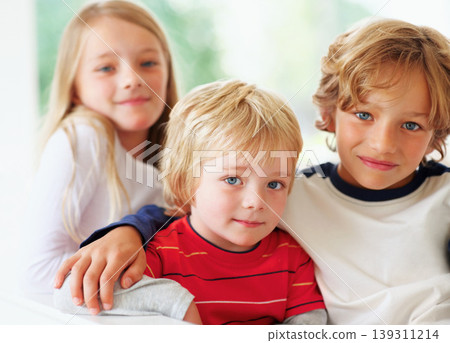 Family portrait, children and together with love trust, hug and bonding with relax wellness in home. Boy, girl and smile face with happiness for siblings support and care with positive in apartment Family portrait, children and together with love trust, hug and bonding with relax wellness in home. Boy, girl and smile face with happiness for siblings support and care with positive in apartment 139311214