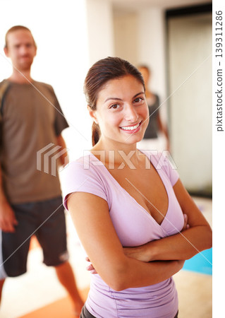 Portrait, smile and confident, woman in yoga class for fitness, commitment and body wellness. Pilates, men and women in gym together in holistic health, mindfulness and happy people at exercise club. Portrait, smile and confident, woman in yoga class for fitness, commitment and body wellness. Pilates, men and women in gym together in holistic health, mindfulness and happy people at exercise club. 139311286