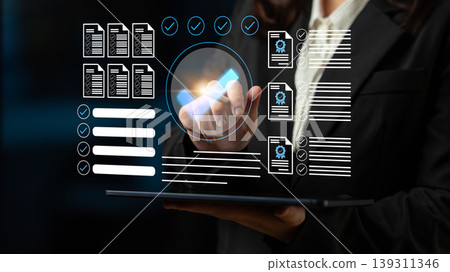 Business professional interacting with digital documents and futuristic interface showcasing data management and productivity in modern workspace Gantry 139311346