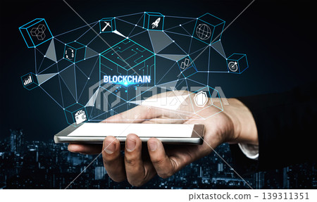Hand Holding Smartphone with Digital Blockchain Interface and Technology Icons Representing Innovation and Connectivity in Modern Business Landscape Quark 139311351