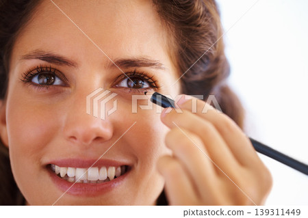 Woman, face and eyeliner with smile for beauty, cosmetics and facial skincare with pride in home. Person, happy or eye application with grooming product or pencil for makeup, cosmetology or aesthetic Woman, face and eyeliner with smile for beauty, cosmetics and facial skincare with pride in home. Person, happy or eye application with grooming product or pencil for makeup, cosmetology or aesthetic 139311449