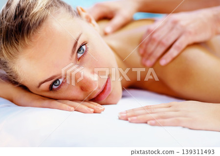 Woman, portrait and massage back with spa therapist for wellness, holistic therapy or cosmetic care at holiday resort. Beauty salon, skincare and face of client relax for treatment, break or vacation Woman, portrait and massage back with spa therapist for wellness, holistic therapy or cosmetic care at holiday resort. Beauty salon, skincare and face of client relax for treatment, break or vacation 139311493