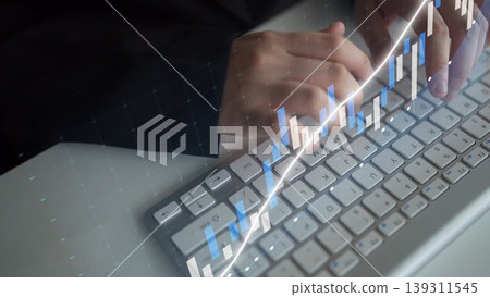 Professional hands typing on a keyboard with digital graphs and charts, representing technology, finance, and data analytics in a modern workspace. Copula Professional hands typing on a keyboard with digital graphs and charts, representing technology, finance, and data analytics in a modern workspace. Copula 139311545