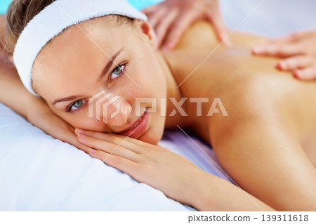 Spa, massage and woman portrait with beauty therapist hands for back care with wellness and health. Resort, masseuse table and calm female person with zen and pamper treatment for relax and relief Spa, massage and woman portrait with beauty therapist hands for back care with wellness and health. Resort, masseuse table and calm female person with zen and pamper treatment for relax and relief 139311618